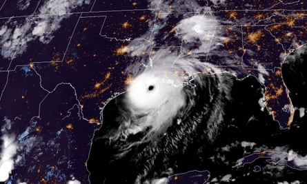 Satellite image shows Hurricane Laura with a distinct eye approaching the Gulf Coast, highlighting the region's resilience at night.